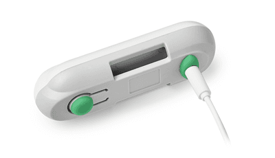 Plantarcare device connected to USB charging cable with red charging indicator