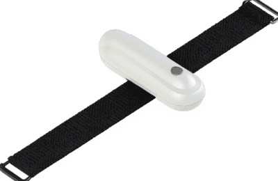 Plantarcare device secured to foot with velcro strap, positioned over heel pain point