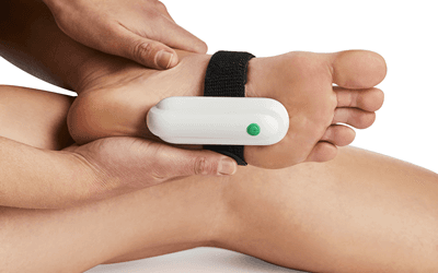 Person relaxing with elevated leg during 10-minute Plantarcare treatment session